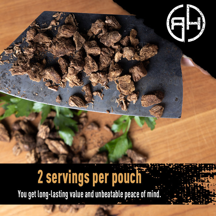 Cut beef dices on a wooden surface