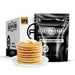 Buttermilk pancake mix with a stack of pancakes
