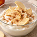 Apple slices in a bowl with yogurt